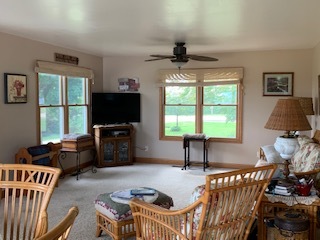 13182 Lyndon Road Morrison, IL 61270 - Photo 8 of 19 a living room with furniture and a flat screen tv