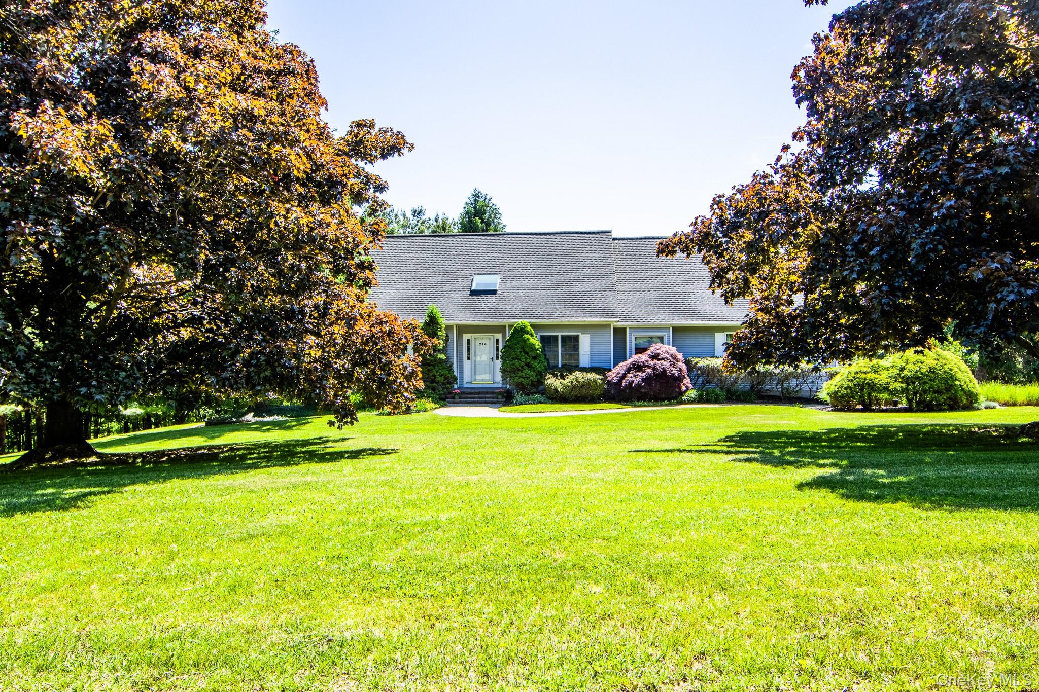 214 West Mombasha Road Monroe, NY 10950 - Photo 3 of 43 a front view of a house with a yard and trees
