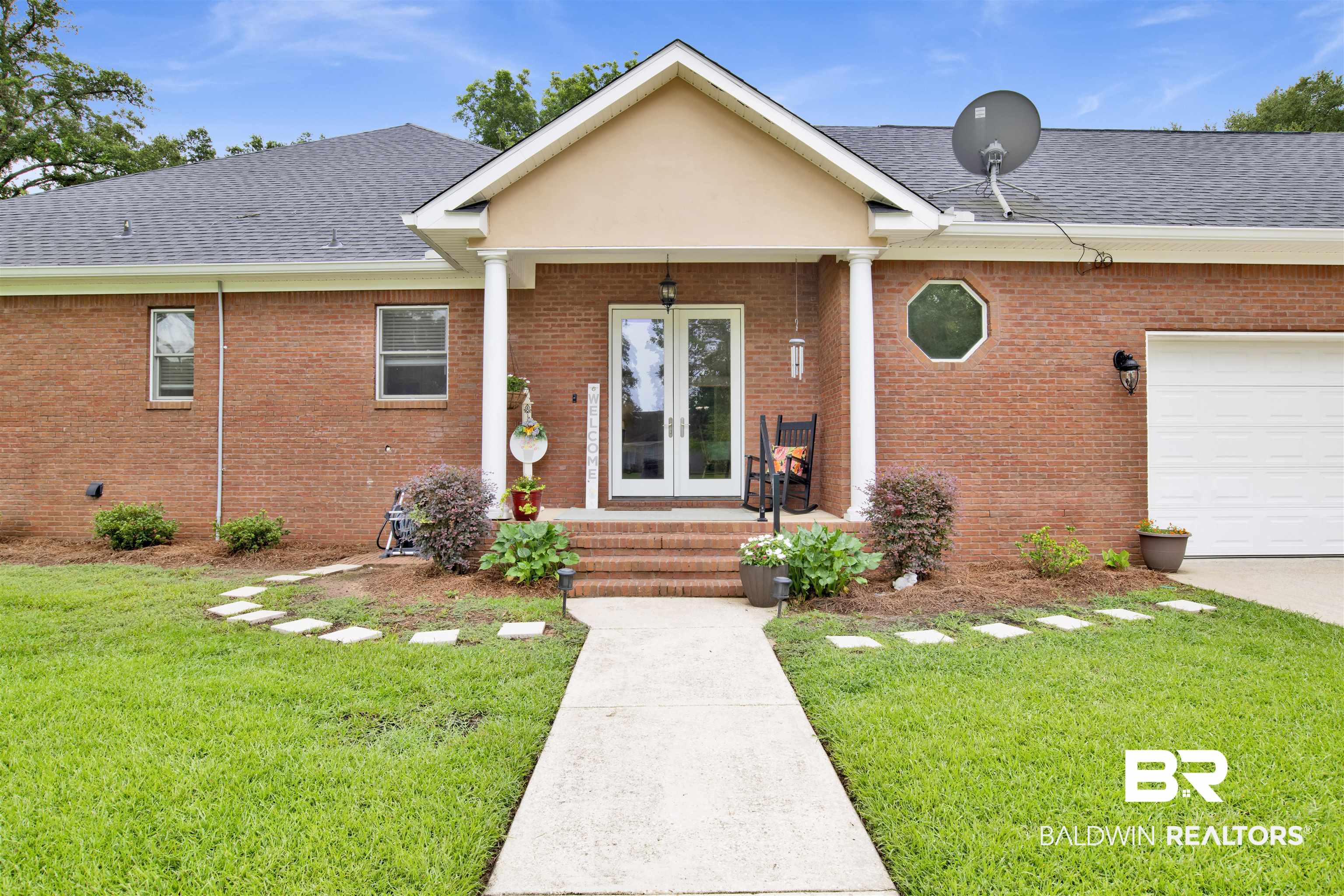 4340 Hamilton Oaks Lane Mobile, AL 36695 - Photo 48 of 51 View of front of home with a front yard and a garage