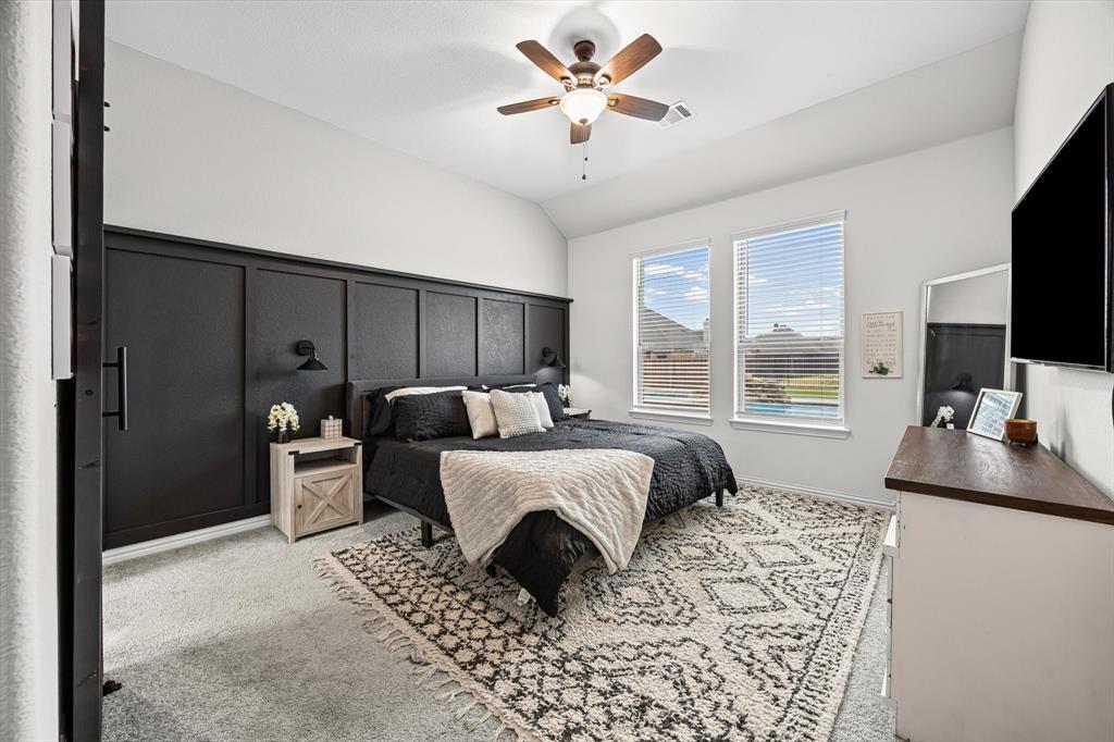 5405 Ranger Drive Midlothian, TX 76065 - Photo 15 of 29 Bedroom featuring light colored carpet, a ceiling fan, and vaulted ceiling