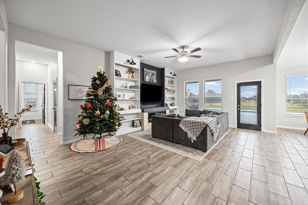 5405 Ranger Drive Midlothian, TX 76065 - Photo 10 of 29 Living room with a ceiling fan and wood tiled floors