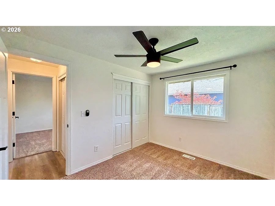 19504 Southwest Stacey Street Beaverton, OR 97003 - Photo 12 of 16 a black and white photo of a living room