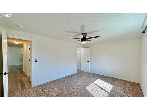 19504 Southwest Stacey Street Beaverton, OR 97003 - Photo 16 of 16 a open hall with a ceiling fan