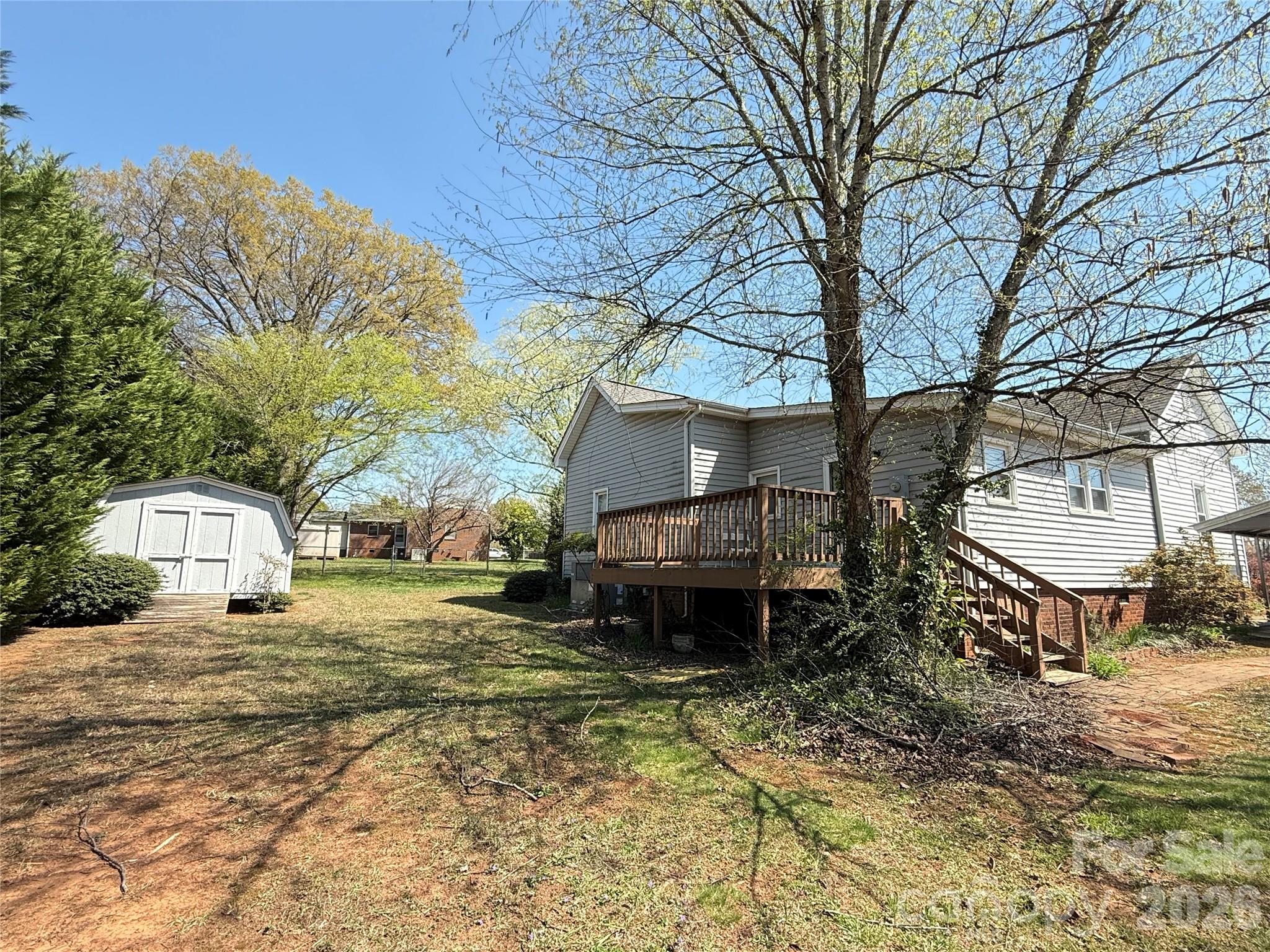 240 Nixon Road Belmont, NC 28012 - Photo 12 of 13 a backyard of a house with barbeque oven and outdoor seating