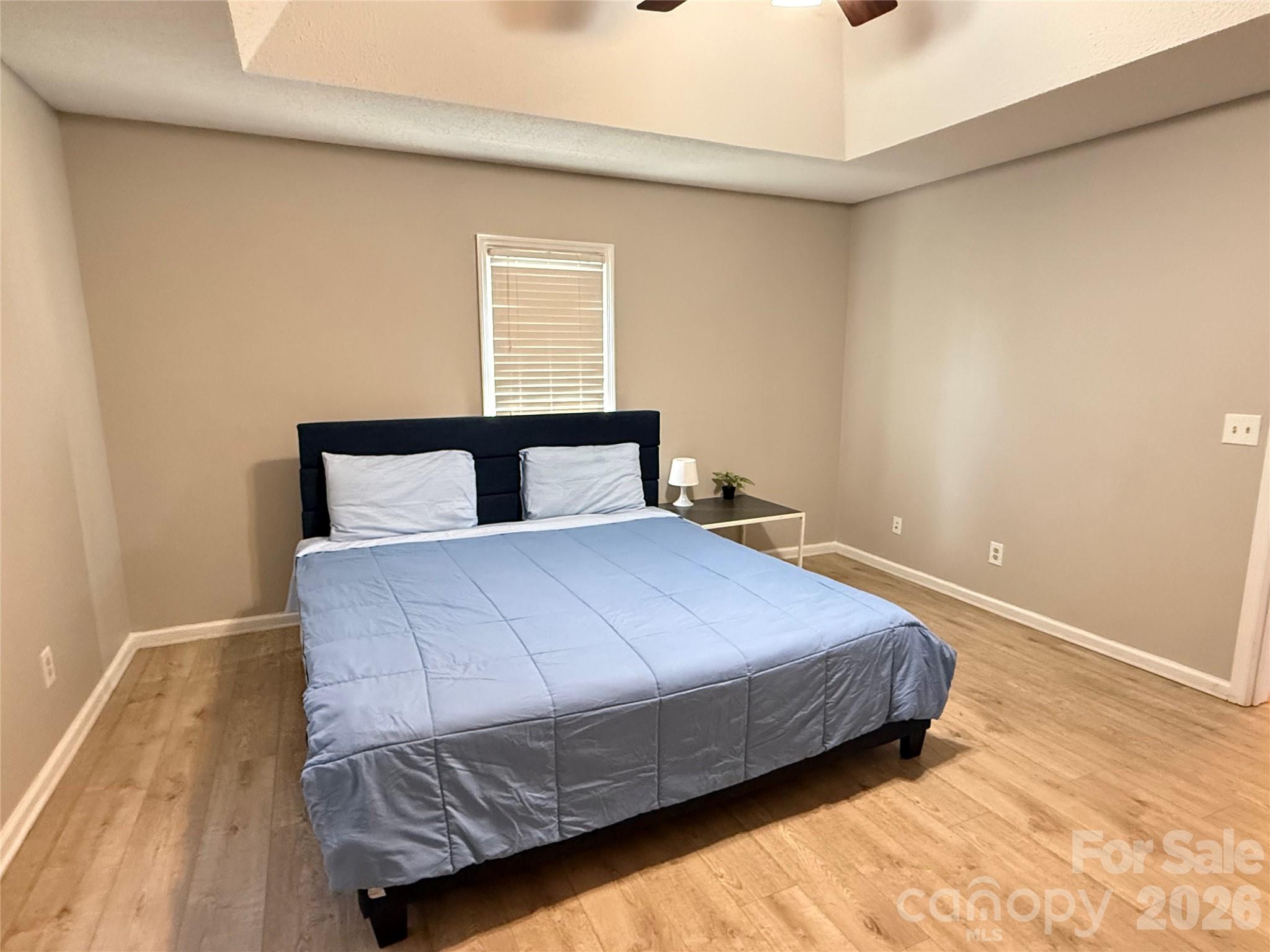240 Nixon Road Belmont, NC 28012 - Photo 6 of 13 a bedroom with a bed and wooden floor