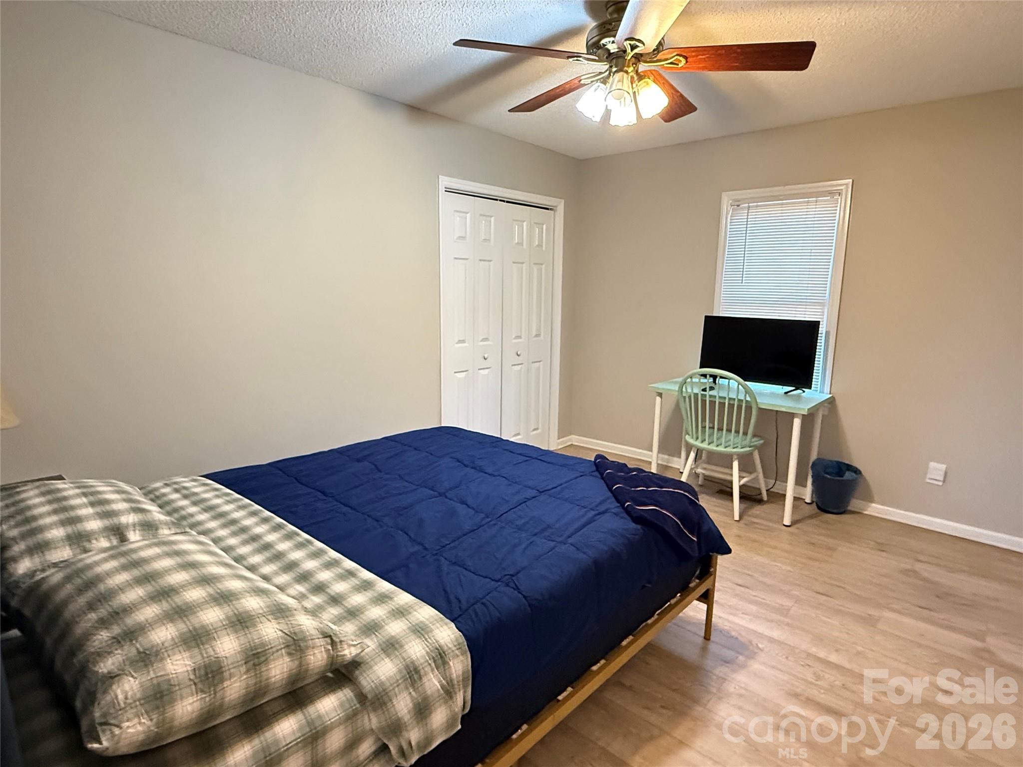 240 Nixon Road Belmont, NC 28012 - Photo 7 of 13 a bedroom with a bed and a chandelier