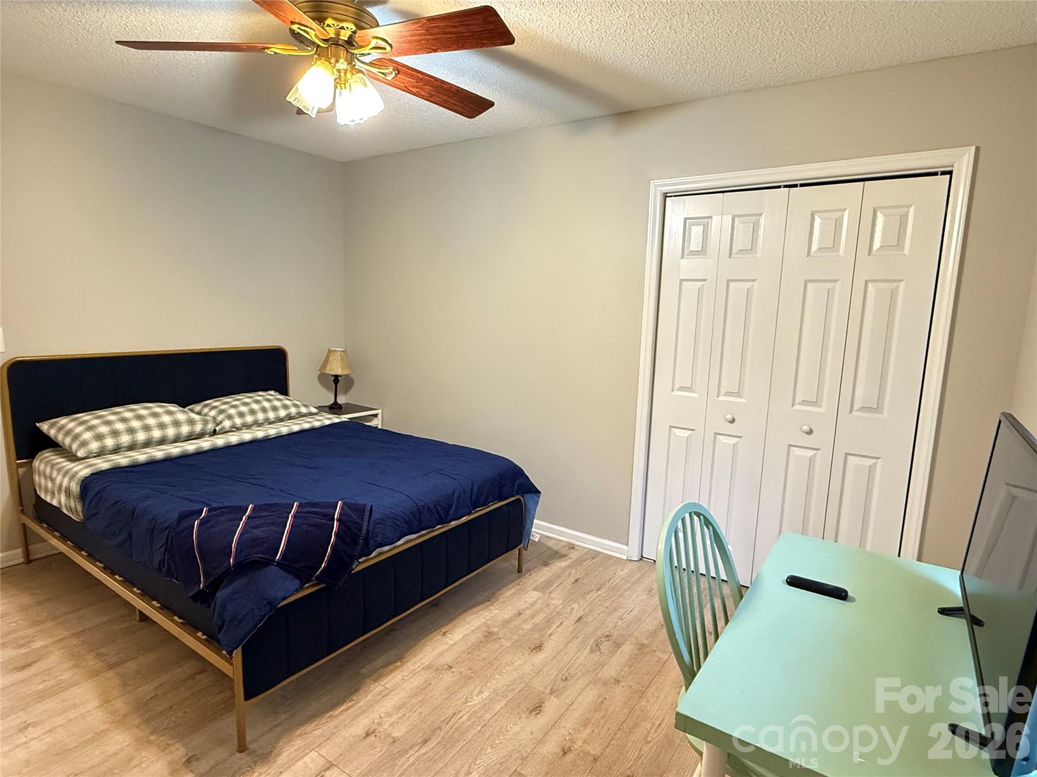 240 Nixon Road Belmont, NC 28012 - Photo 9 of 13 a bedroom with a bed and a chandelier