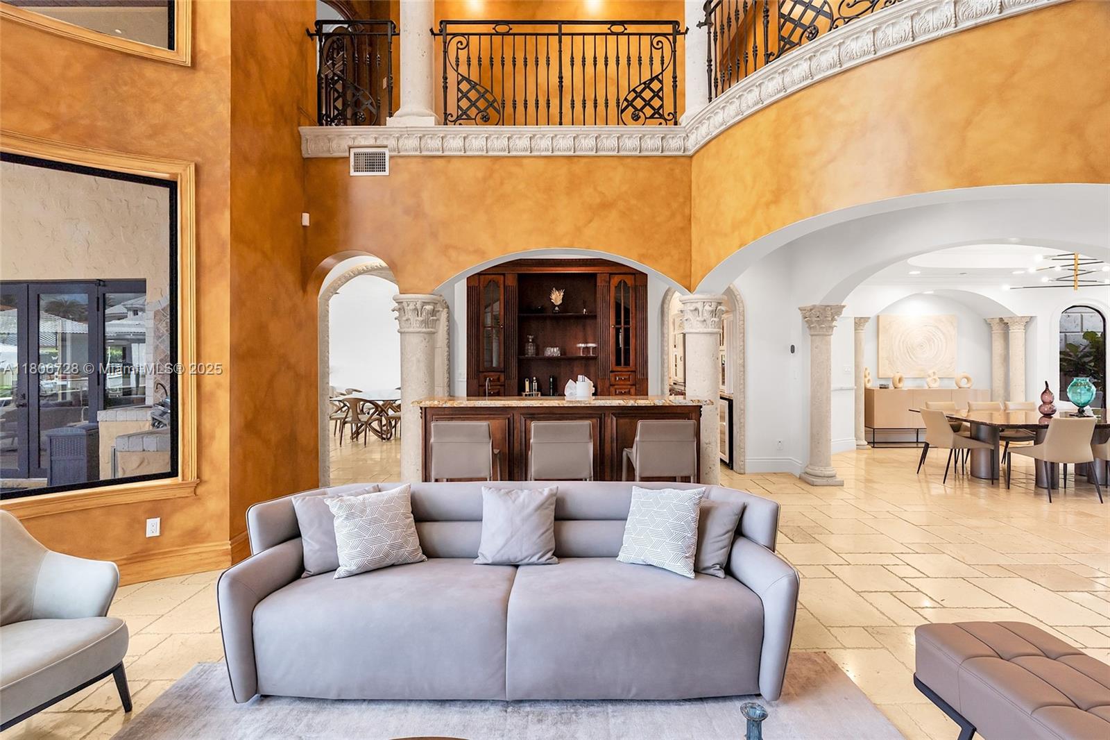 1011 Rhodes Villa Avenue Delray Beach, FL 33483 - Photo 17 of 90 a living room with furniture and a fireplace