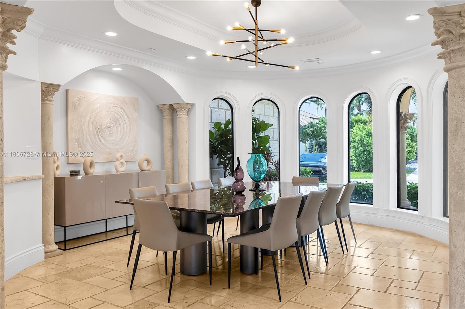 1011 Rhodes Villa Avenue Delray Beach, FL 33483 - Photo 19 of 90 a view of a dining room with furniture window and outside view