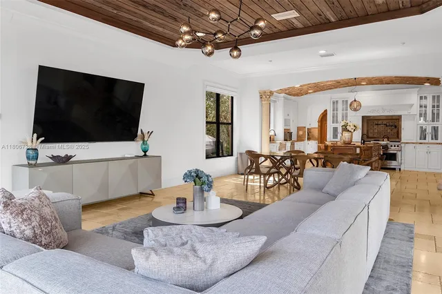a view of staircase with lots of frames on wall and windows
