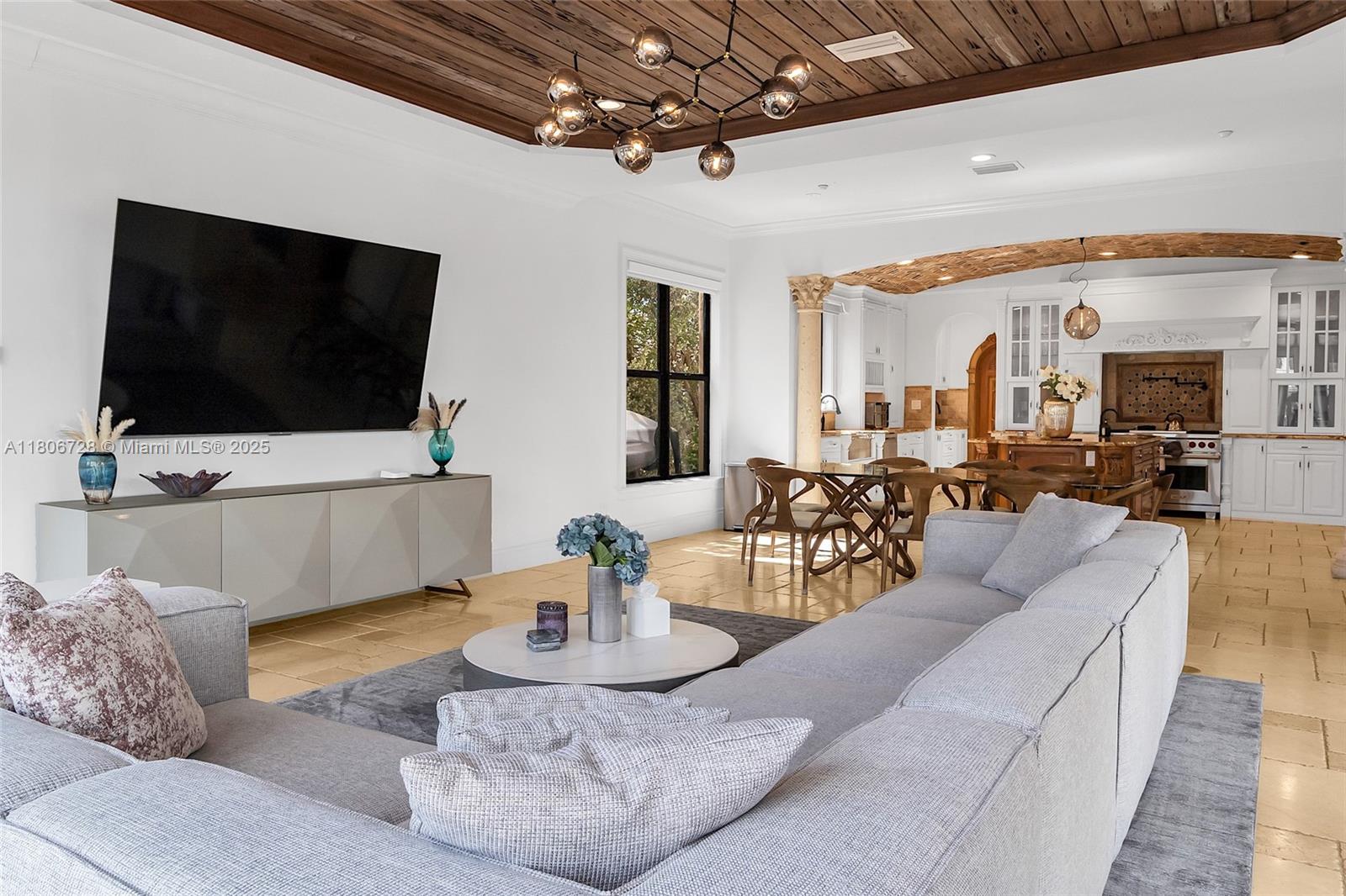 1011 Rhodes Villa Avenue Delray Beach, FL 33483 - Photo 34 of 90 a living room with furniture and a flat screen tv