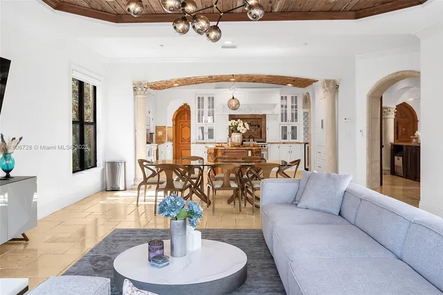 a bedroom with a large bed and a large window