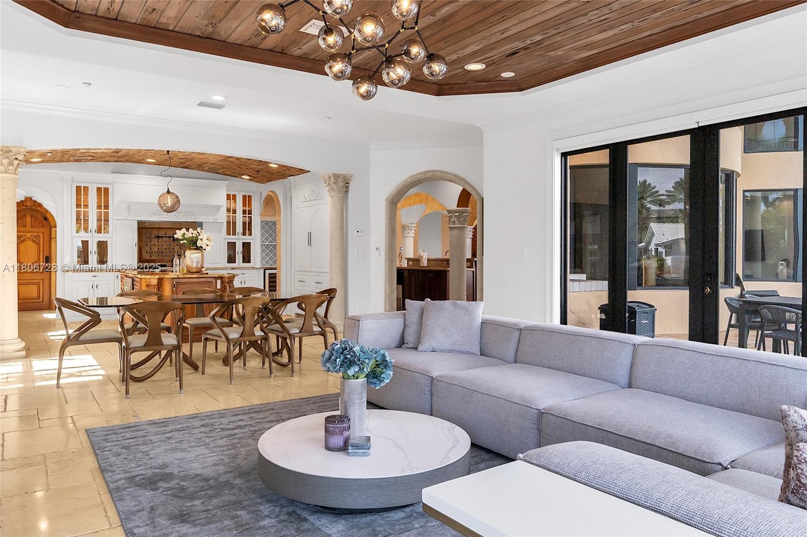 1011 Rhodes Villa Avenue Delray Beach, FL 33483 - Photo 36 of 90 a living room with furniture and a large window