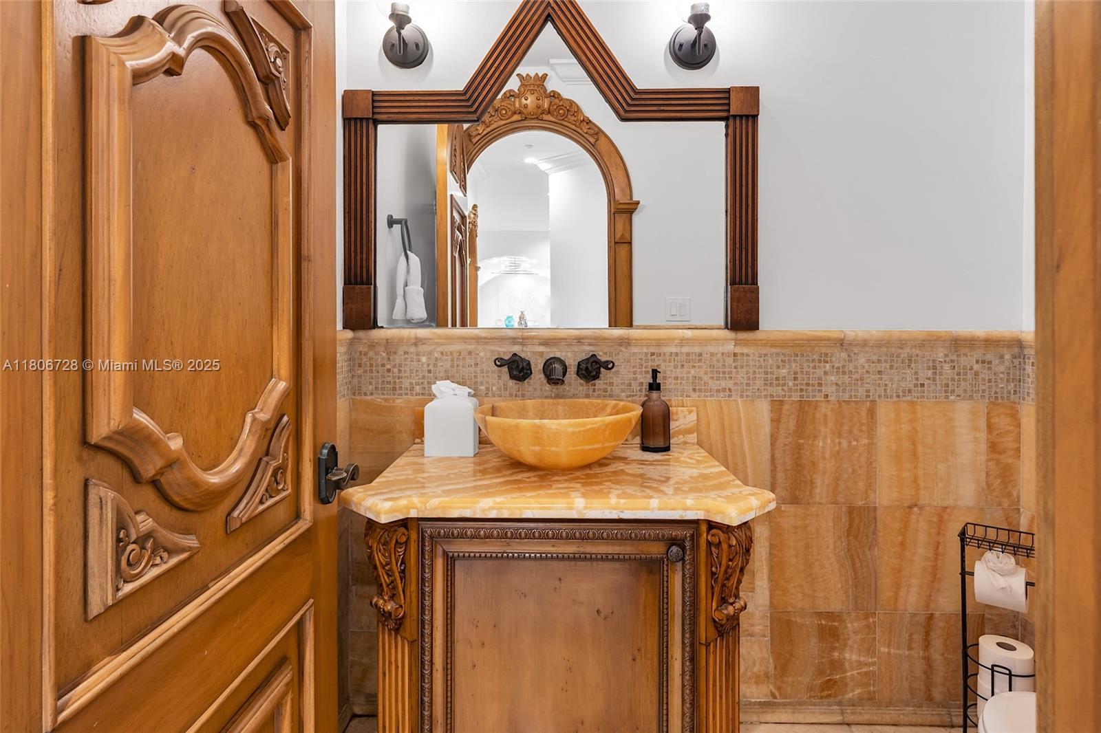1011 Rhodes Villa Avenue Delray Beach, FL 33483 - Photo 38 of 90 a bathroom with a sink and a mirror