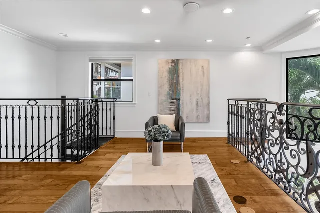 a spacious bedroom with a bed a couch and dresser