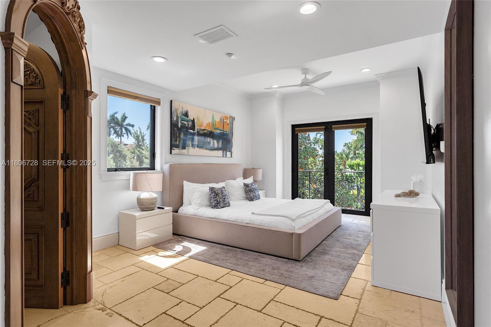 1011 Rhodes Villa Avenue Delray Beach, FL 33483 - Photo 48 of 90 a bedroom with a large bed and a window