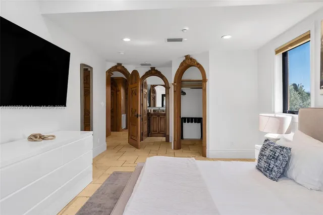 a outdoor patio with swimming pool and table and chairs