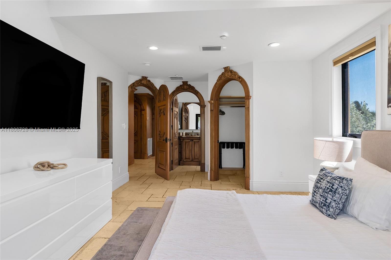 1011 Rhodes Villa Avenue Delray Beach, FL 33483 - Photo 49 of 90 a living room with furniture and a flat screen tv