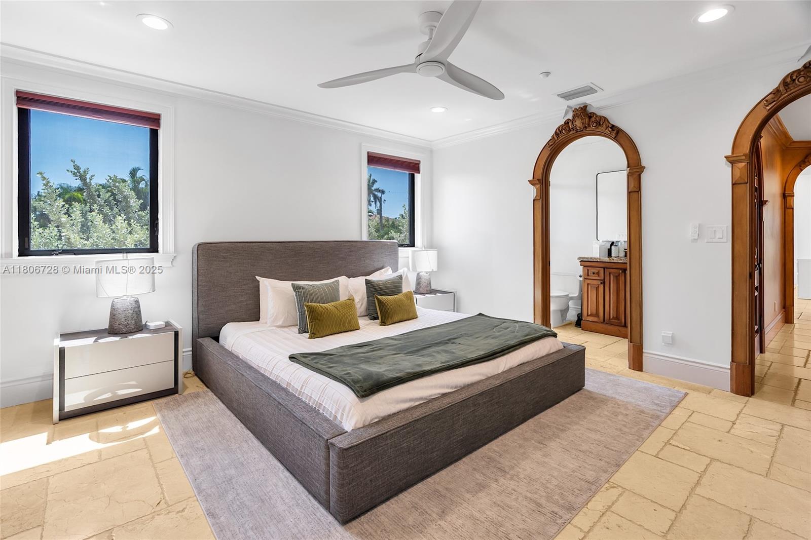 1011 Rhodes Villa Avenue Delray Beach, FL 33483 - Photo 57 of 90 a bedroom with a large bed couch and window