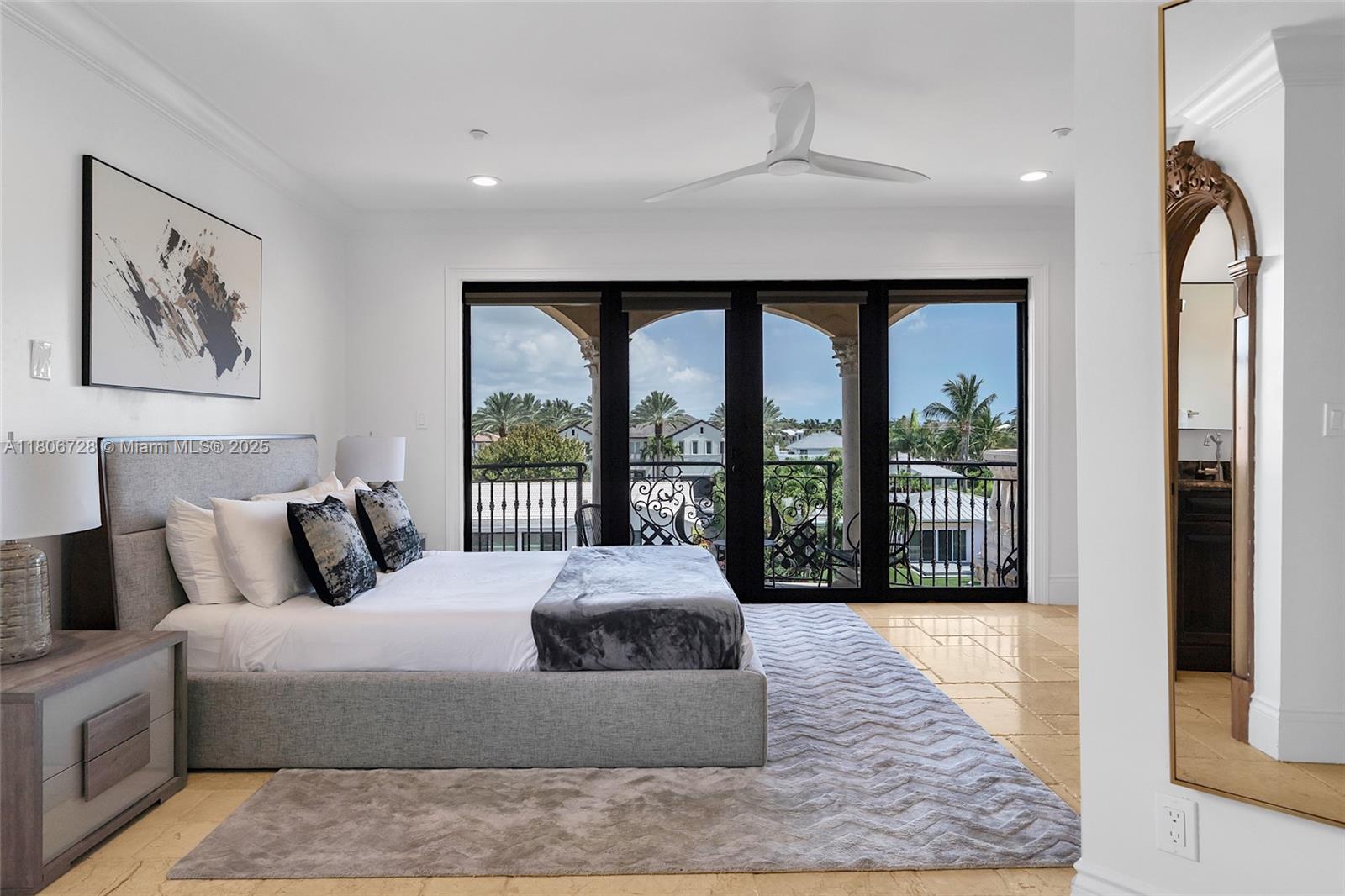 1011 Rhodes Villa Avenue Delray Beach, FL 33483 - Photo 65 of 90 a large bedroom with a large bed and a large window