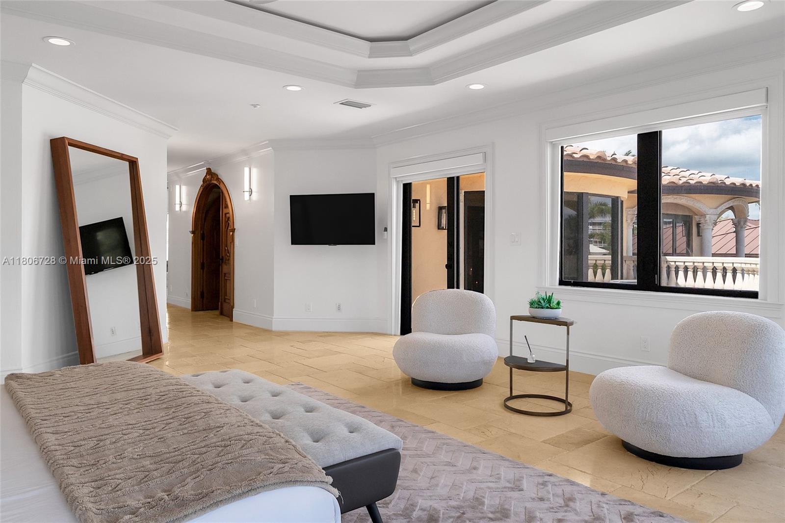 1011 Rhodes Villa Avenue Delray Beach, FL 33483 - Photo 76 of 90 a living room with furniture and a flat screen tv