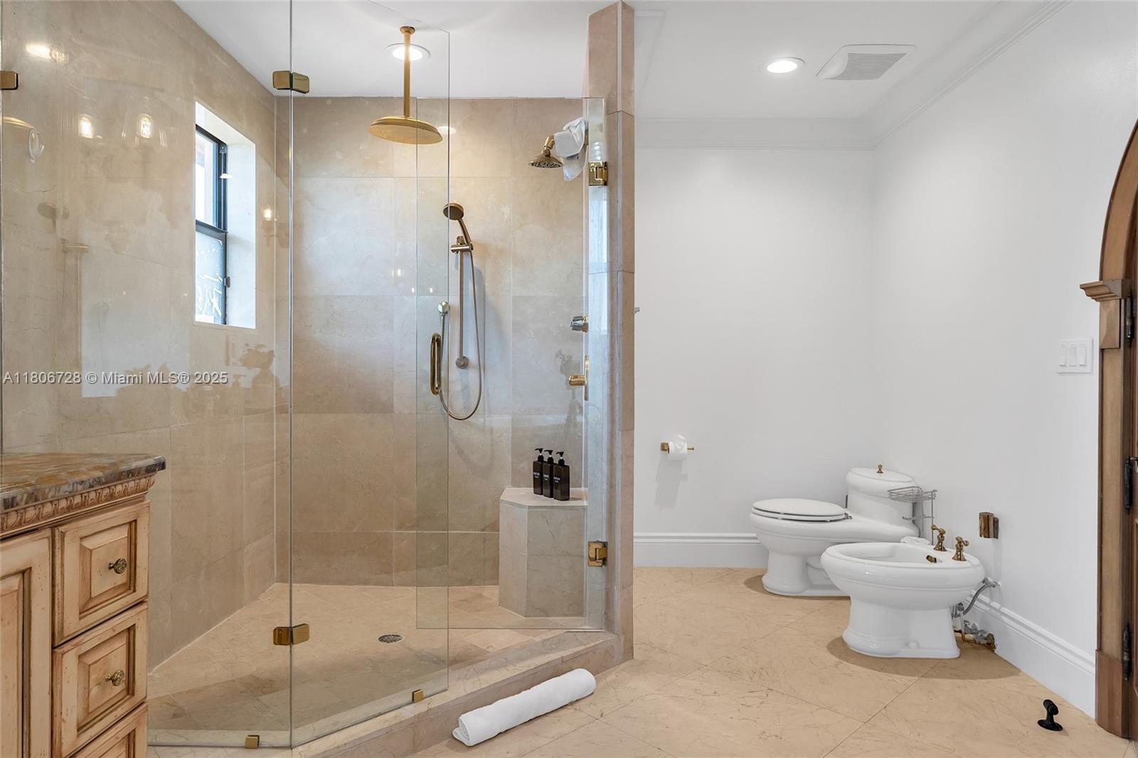 1011 Rhodes Villa Avenue Delray Beach, FL 33483 - Photo 79 of 90 a bathroom with a shower a toilet and a shower