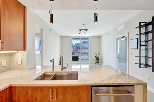 a view of an empty room with a fireplace