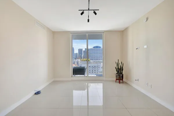 a large kitchen with stainless steel appliances kitchen island granite countertop a sink and cabinets