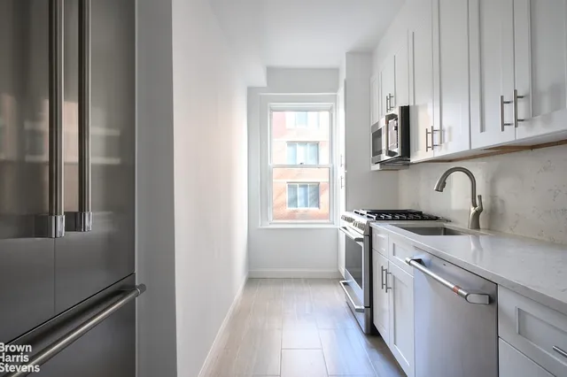 a view of a patio with chairs and tables