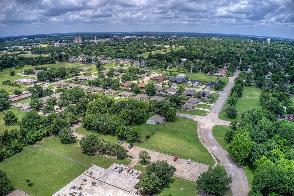 Tbd Washington Street Commerce, TX 75428 - Photo 1 of 13 an aerial view of a house with a garden