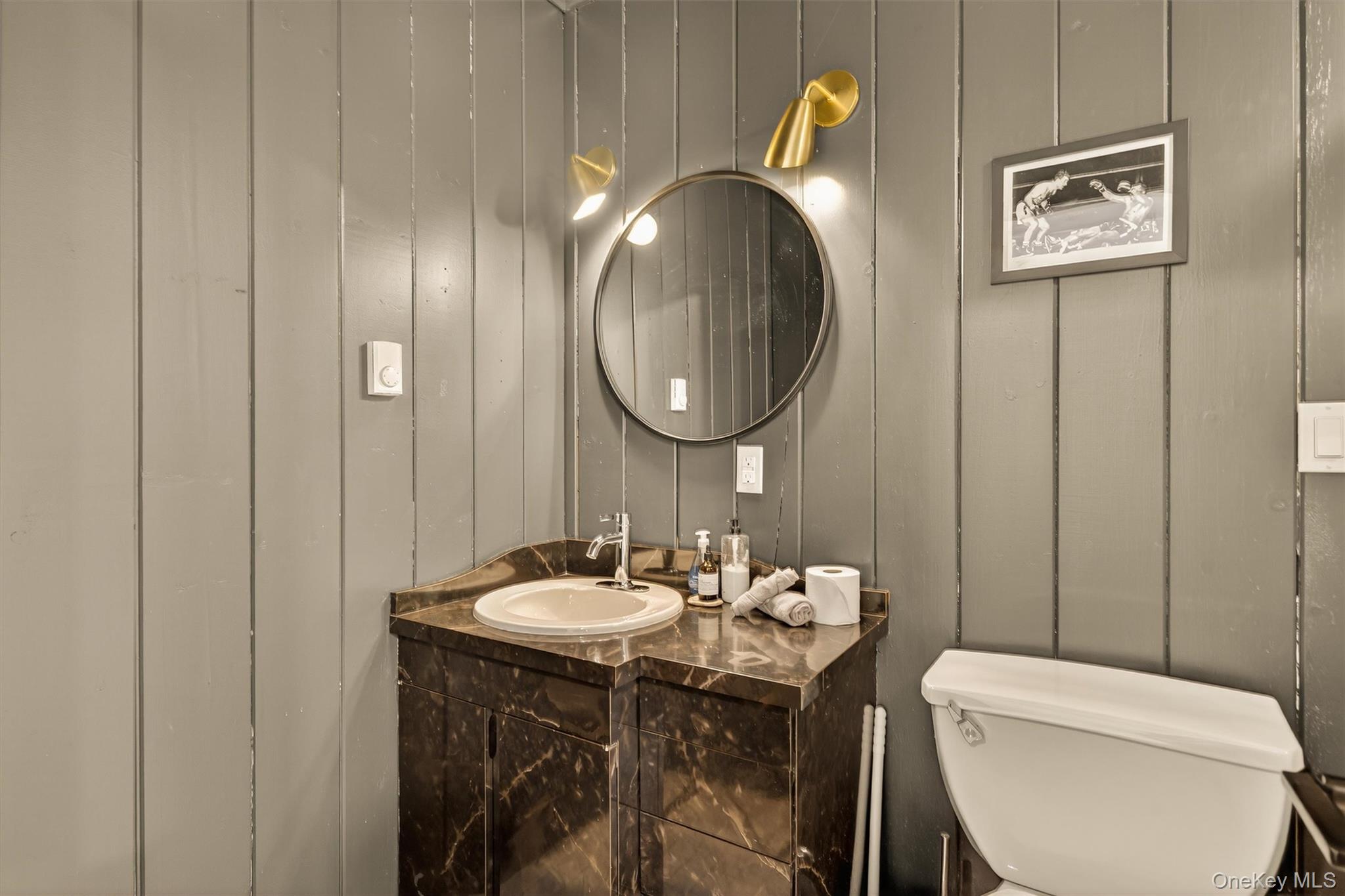 351 Gables Road Narrowsburg, NY 12764 - Photo 31 of 49 a bathroom with a toilet a sink and mirror