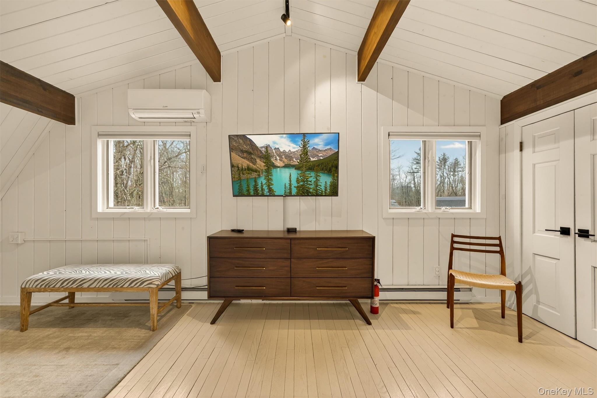351 Gables Road Narrowsburg, NY 12764 - Photo 40 of 49 a living room with furniture a flat screen tv and a window