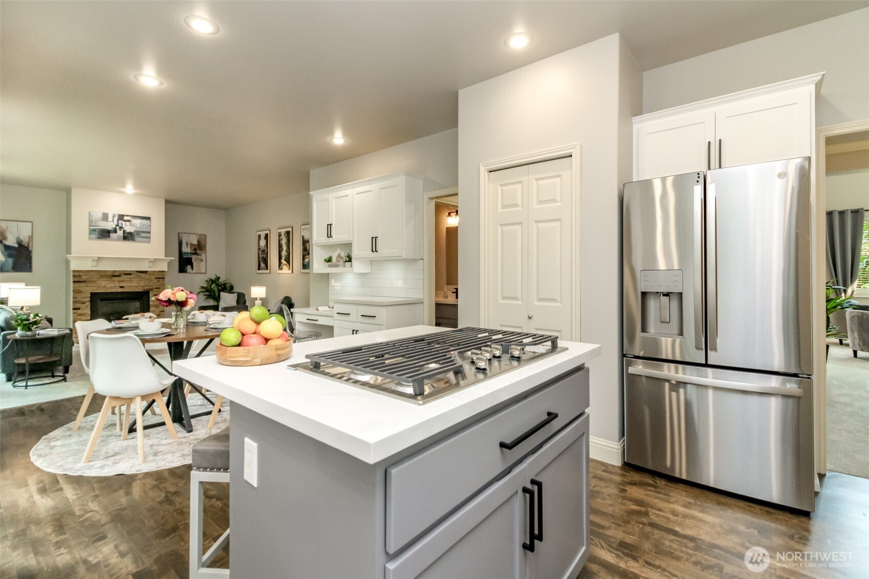 1913 Northeast 32nd Street Renton, WA 98056 - Photo 20 of 40 a kitchen with a stove a refrigerator and a dining table