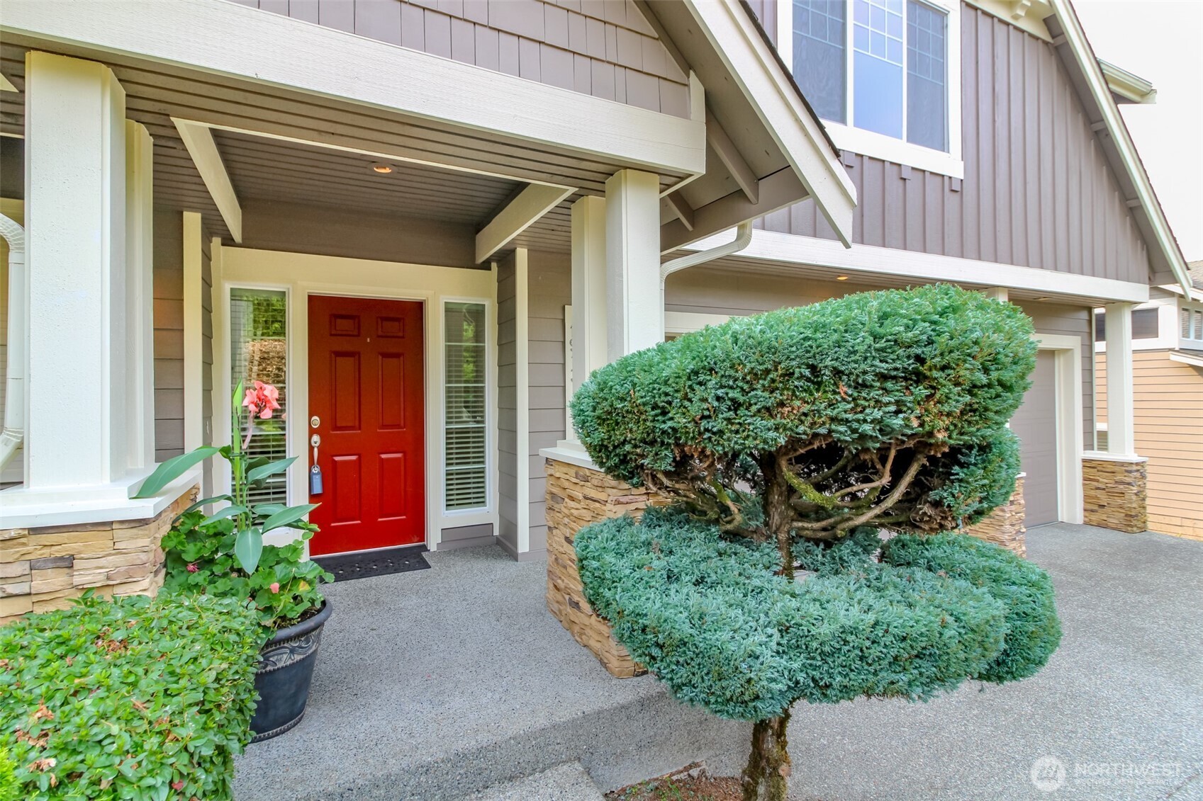 1913 Northeast 32nd Street Renton, WA 98056 - Photo 2 of 40 a front view of a house with garden