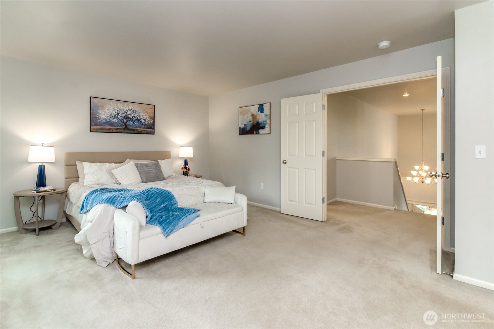 1913 Northeast 32nd Street Renton, WA 98056 - Photo 22 of 40 a bedroom with a bed and a painting on the wall
