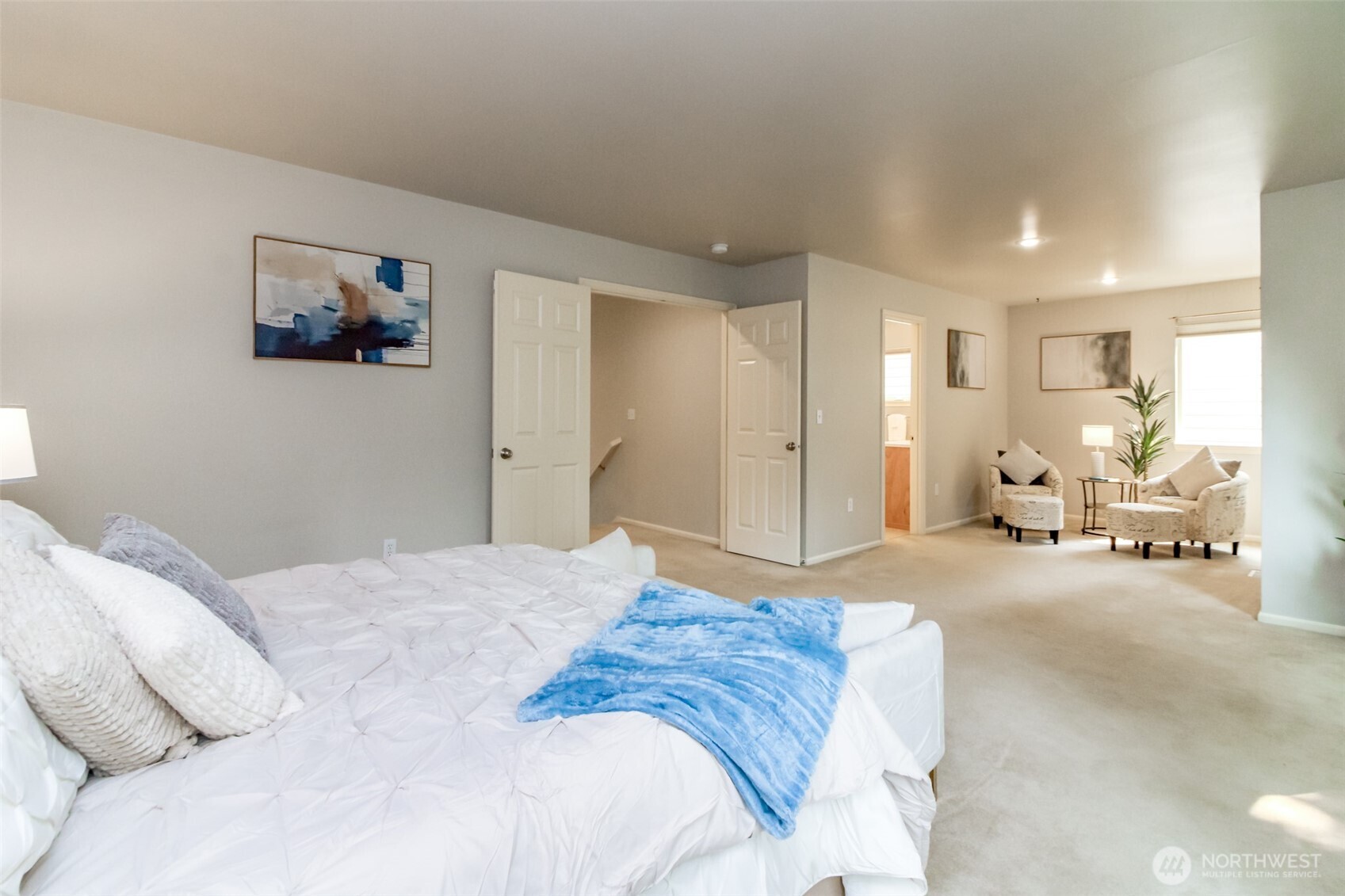 1913 Northeast 32nd Street Renton, WA 98056 - Photo 23 of 40 a spacious bedroom with a bed and furniture