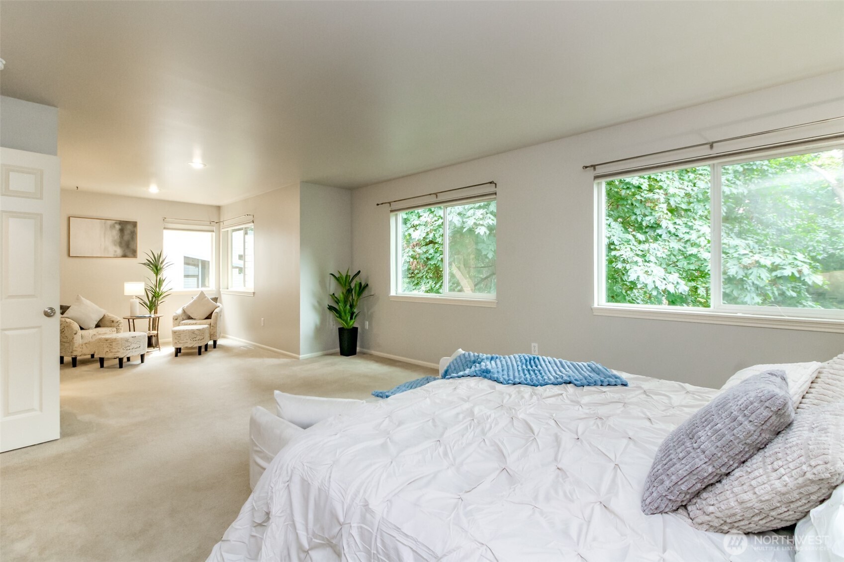 1913 Northeast 32nd Street Renton, WA 98056 - Photo 24 of 40 a bedroom with a bed and a large window