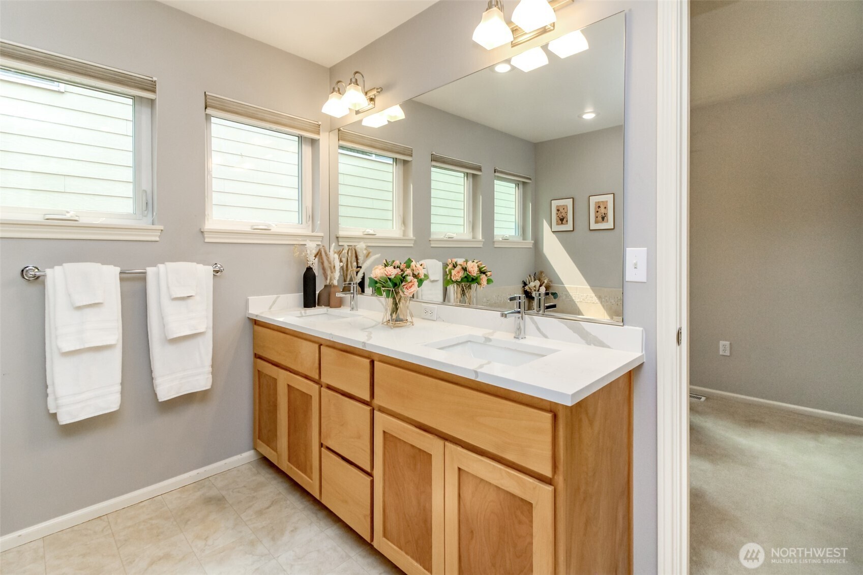 1913 Northeast 32nd Street Renton, WA 98056 - Photo 27 of 40 a bathroom with a sink double vanity and a mirror