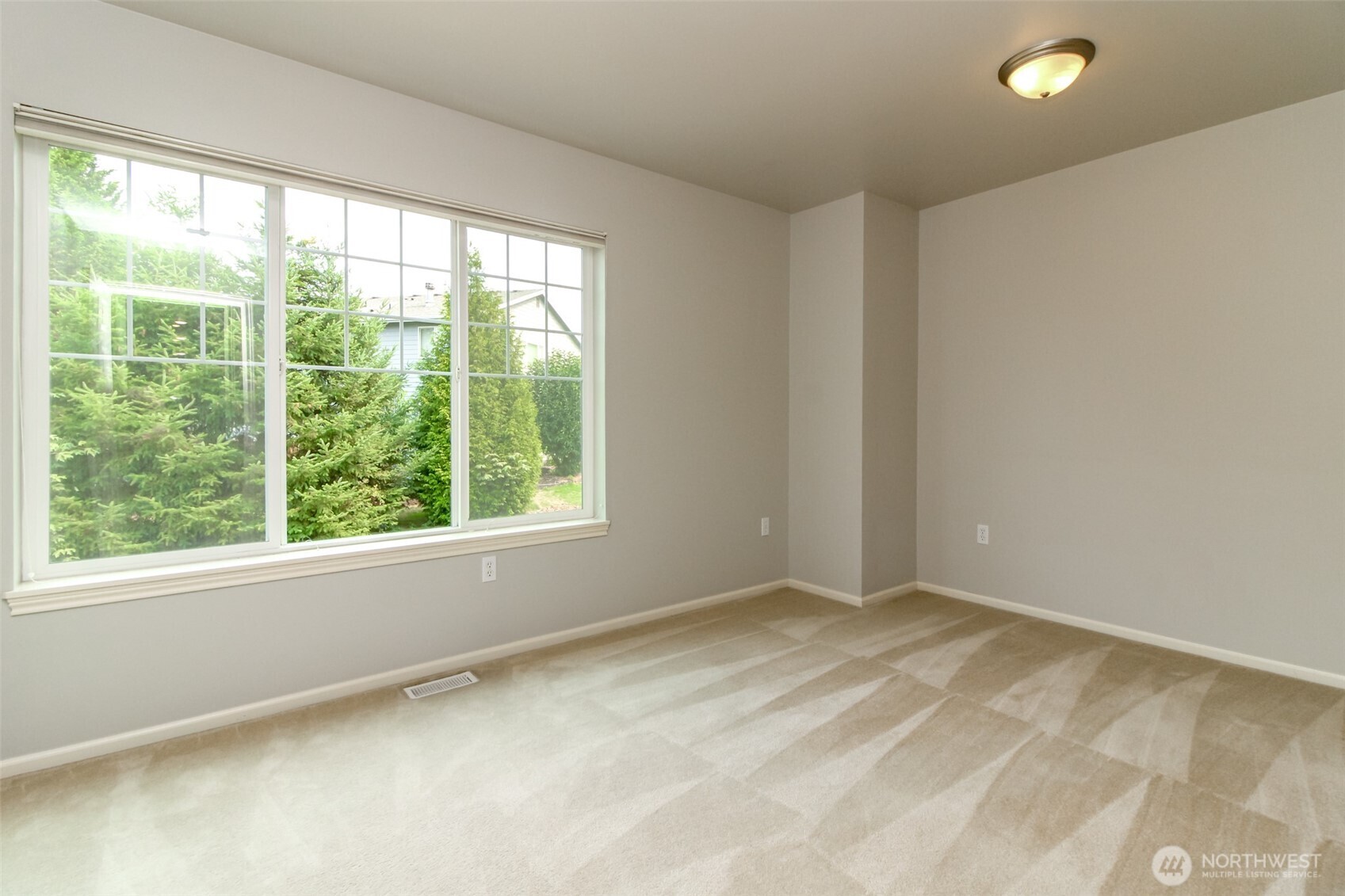 1913 Northeast 32nd Street Renton, WA 98056 - Photo 32 of 40 a view of a big room with a large window