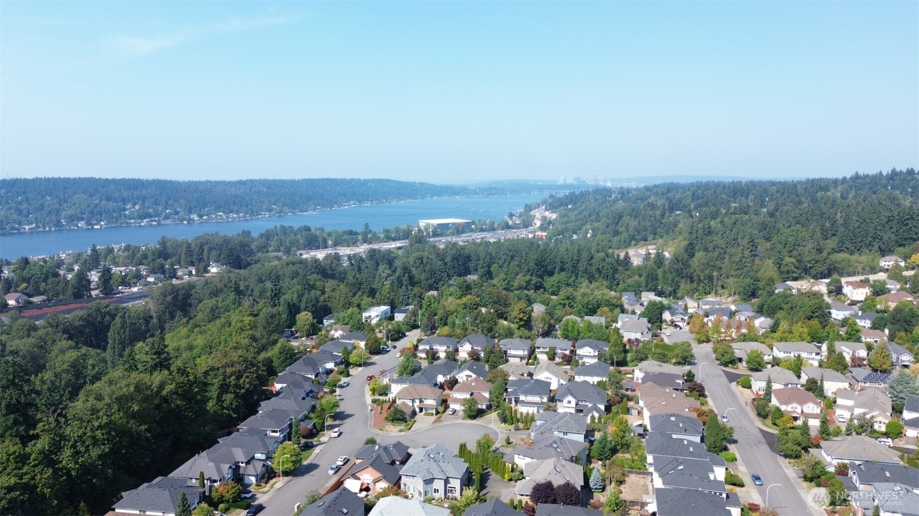 1913 Northeast 32nd Street Renton, WA 98056 - Photo 36 of 40 an aerial view of a city with lots of residential buildings and mountain view in back