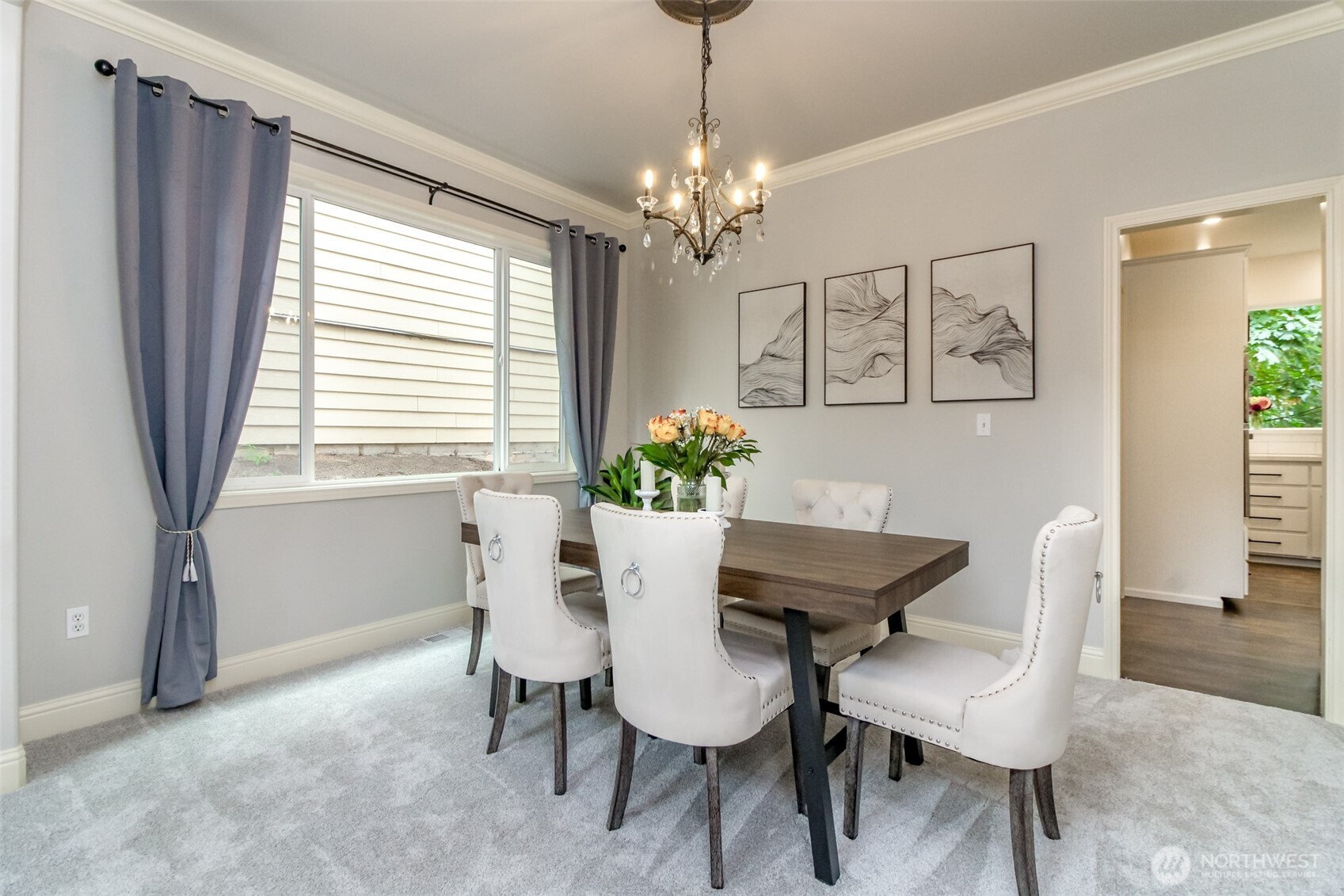 1913 Northeast 32nd Street Renton, WA 98056 - Photo 6 of 40 a view of a dining room with furniture and a chandelier