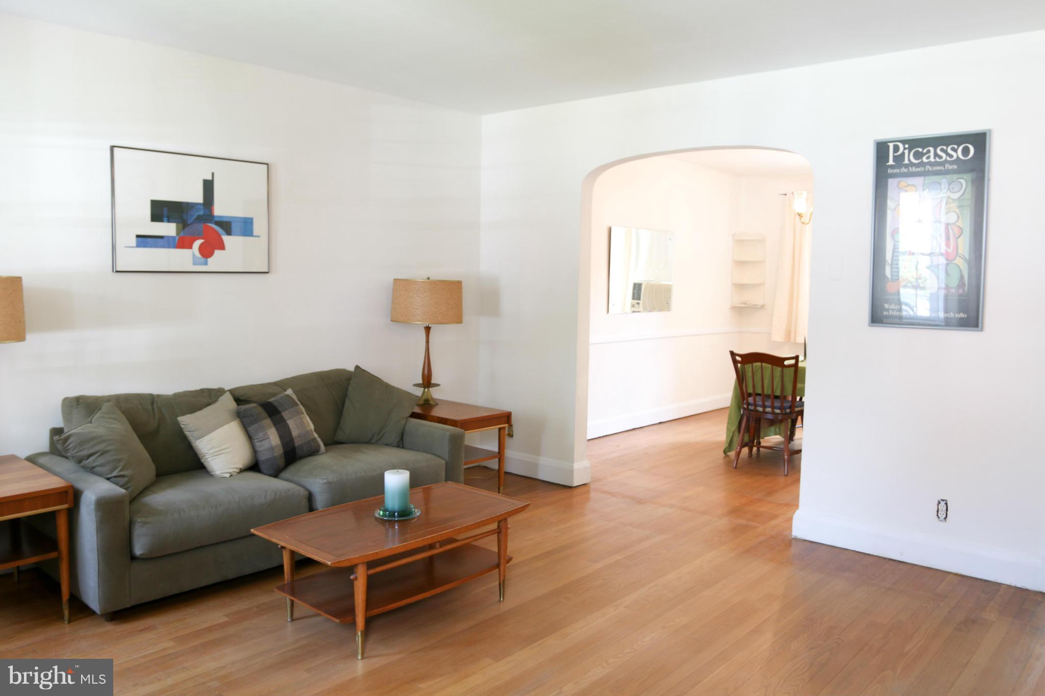 309 Westowne Road Baltimore, MD 21229 - Photo 2 of 20 a living room with furniture and a wooden floor