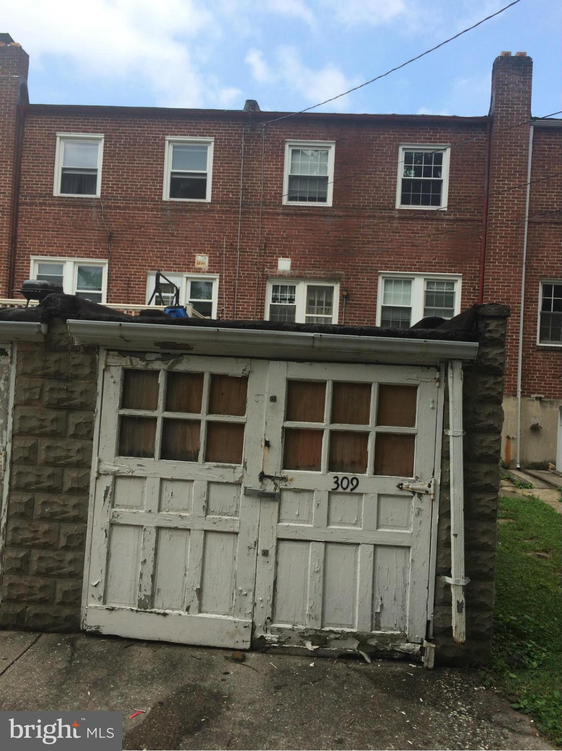 309 Westowne Road Baltimore, MD 21229 - Photo 18 of 20 a front view of a house with a yard