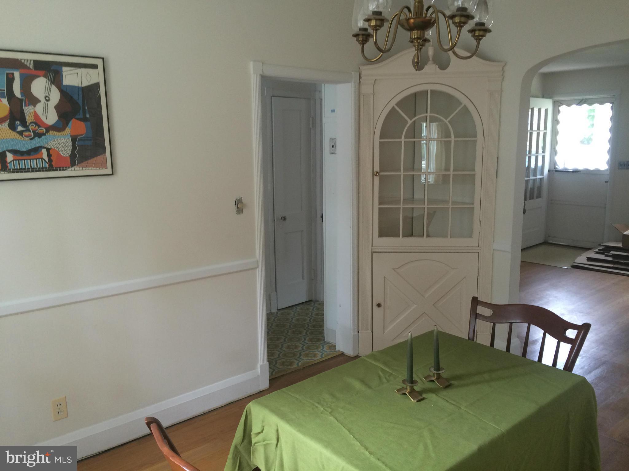 309 Westowne Road Baltimore, MD 21229 - Photo 6 of 20 a view of a dining room with a table and chairs