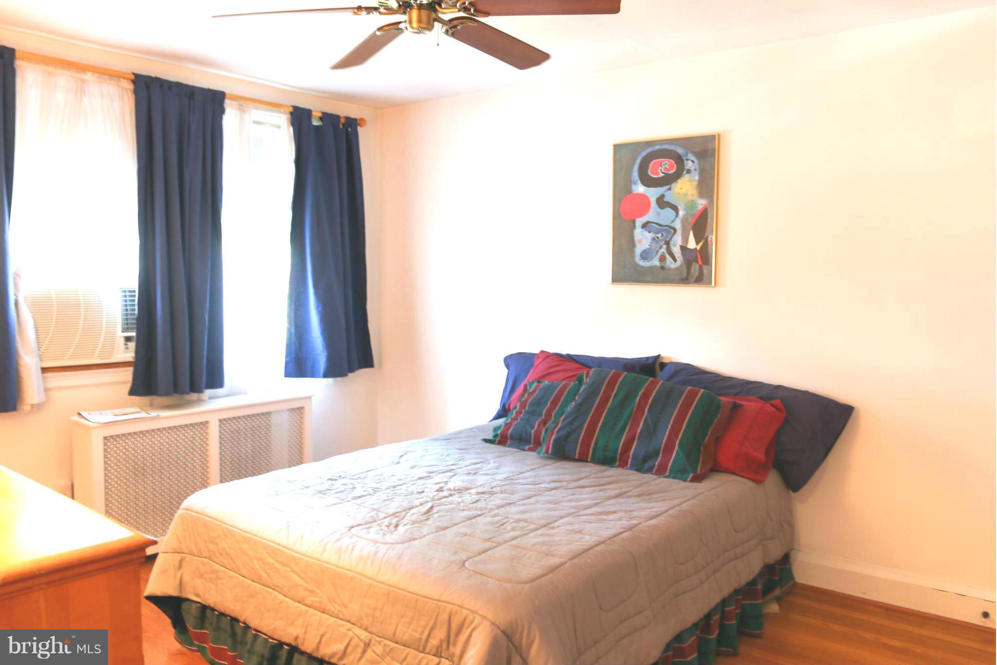 309 Westowne Road Baltimore, MD 21229 - Photo 10 of 20 a bedroom with a bed and a window
