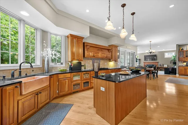 a kitchen with lots of counter space a sink and a window