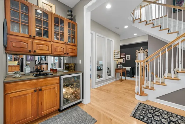 a kitchen with stainless steel appliances granite countertop a refrigerator and cabinets