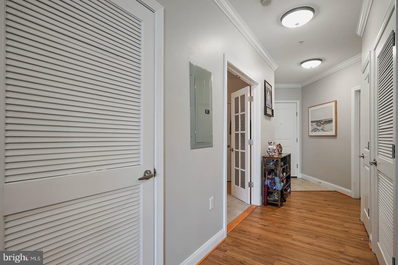 1391 Pennsylvania Ave. Southeast, Unit 331 Washington, DC 20003 - Photo 20 of 29 Inviting hallway with warm wood accents.