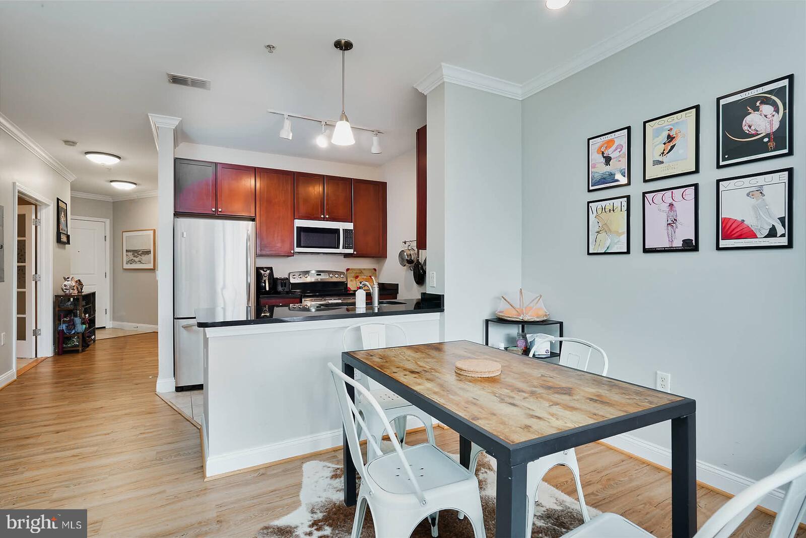 1391 Pennsylvania Ave. Southeast, Unit 331 Washington, DC 20003 - Photo 8 of 29 Chic urban kitchen with stylish dining area.
