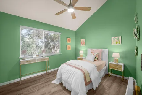 a bedroom with a bed and a window